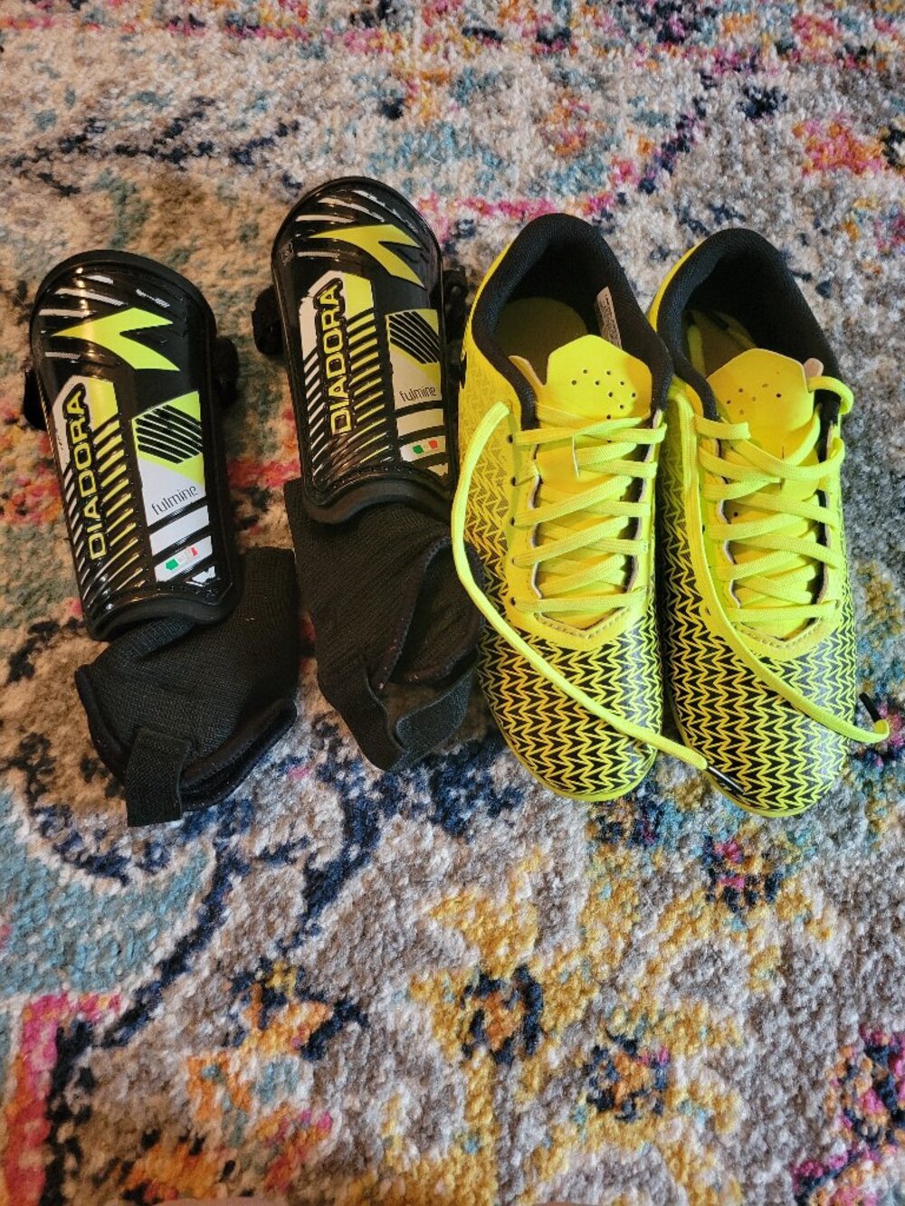 Under Armour brand cleats & shin guards set